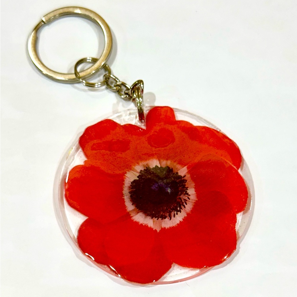 Red flower badge reel with belt clip